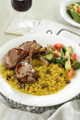Tangy BBQ roast rack of lamb with yellow rice