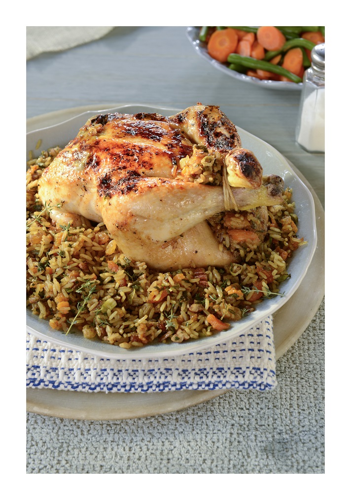 Roast chickens with a pecan nut and dried fruit curried rice stuffing