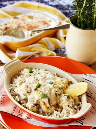 Creamy Fish Casserole with Mushrooms and Peppers Served with Brown Rice