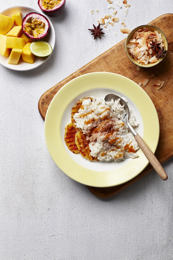 Fragrant rice pudding with coconut caramel and tropical fruit