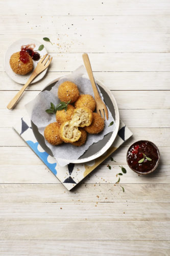 Crispy Arancini bites with Brie served with cranberry sauce