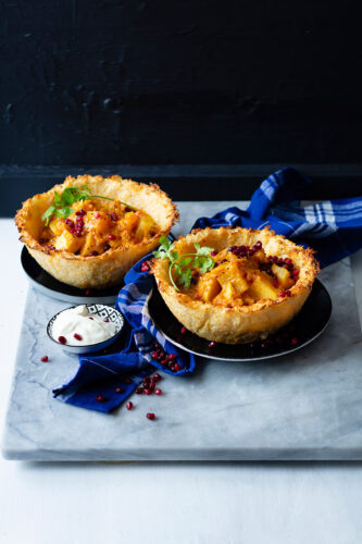 Indian vegetable curry in edible rice bowls